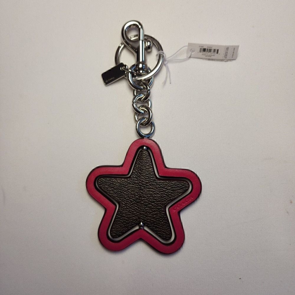 NWT Coach CP899 Spinning Star Bag Charm In Signature Canvas Bright Violet
